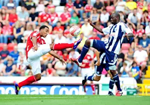 Season 11-12 Prints: Bristol City vs. West Brom: Intense Battle Between Nicky Maynard and Youssouf Mulumbu in Championship Match