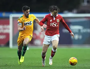 Bristol City V Yeovil Town Prints: Bristol City vs Yeovil Town: Luke Freeman vs Joe Edwards Clash at Ashton Gate