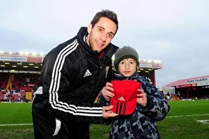 Images Dated 12th January 2013: Bristol City: Young Fan Receives Special Surprise from Sam Baldock at Ashton Gate