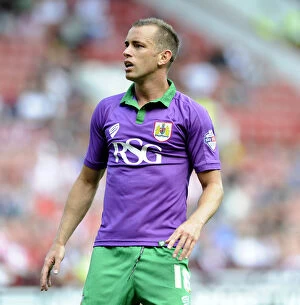 Images Dated 9th August 2014: Bristol City's Aaron Wilbraham in Action Against Sheffield United at Bramal Lane