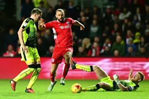 Bristol City's Aaron Wilbraham Dodges Paul McShane's Challenge in Sky Bet Championship Match