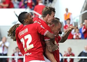 Images Dated 15th August 2015: Bristol City's Aaron Wilbraham Leads Euphoric Celebration After Goal Against Brentford