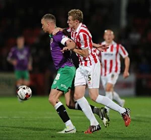Images Dated 8th October 2014: Bristol City's Aaron Wilbraham Secures Ball Against Cheltenham Town's Jack Deaman - Football Rivalry