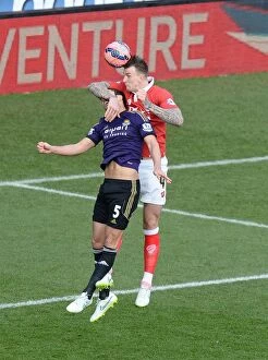 Images Dated 25th January 2015: Bristol City's Aden Flint Outjumps West Ham's James Tomkins for a Powerful Aerial Battle