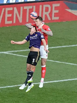 Bristol City's Aden Flint Outjumps West Ham's James Tomkins for a Powerful Aerial Battle