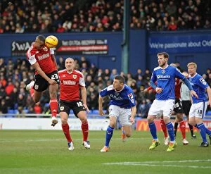 Images Dated 8th February 2014: Bristol City's Aden Flint Scores the Rebound after Tyrone Barnett's Header is Saved - Oldham