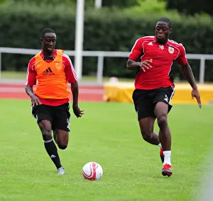 Training Prints: Bristol Citys Albert Adomah battles for the ball with Bristol Citys John Akinde