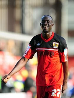 Images Dated 22nd September 2012: Bristol City's Albert Adomah Embraces Fans in Euphoric Victory Celebrations at Vicarage Road