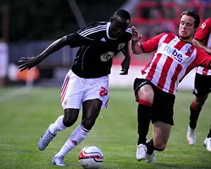Images Dated 26th July 2010: Bristol Citys Albert Adomah is fouled by Ryan Harley