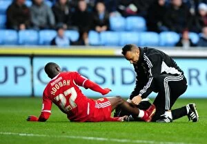 Images Dated 26th December 2011: Bristol City's Albert Adomah Receives Penalty Area Treatment in Coventry City vs