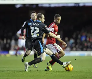 Bristol City's Bobby Reid Tackled by Stevenage's David Gray during Sky Bet League One Match