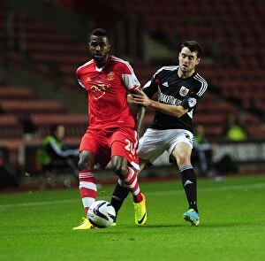 Images Dated 24th September 2013: Bristol City's Brendan Moloney Closes In on Southampton's Guilherme do Prado in Intense Capital