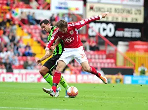 Bristol City V Brighton Prints: Bristol City's Brett Pitman vs Marcos Painter: Championship Battle at Ashton Gate