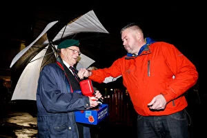 Images Dated 3rd November 2015: Bristol City's Buster Footman Collects Poppy Donations in the Rain Before Match vs. Wolves