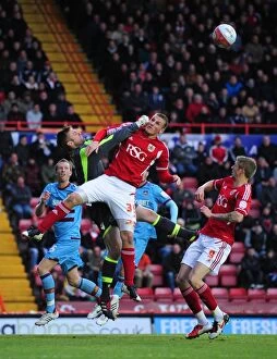 Images Dated 17th April 2012: Bristol City's Chris Wood vs. West Ham's Robert Green: A Battle for Supremacy