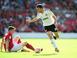 Images Dated 18th August 2012: Bristol City's Cole Skuse Dashes Past Nottingham Forest's Greg Halford in Championship Clash