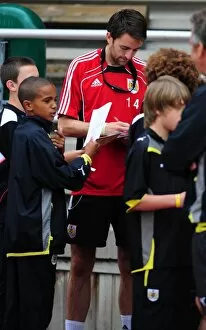 Images Dated 19th July 2010: Bristol Citys Cole Skuse signs autographs