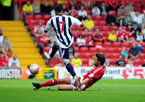 Season 11-12 Prints: Bristol City's Cole Skuse Tackles Jerome Thomas in Championship Clash vs