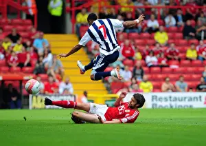 Season 11-12 Prints: Bristol City's Cole Skuse Takes Charge: A Pivotal Moment in the 2011 Championship Match Against West Brom