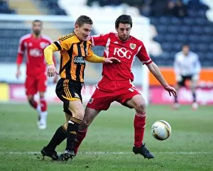 Images Dated 11th February 2012: Bristol City's Cole Skuse vs. Hull City's Andy Dawson - Championship Clash at KC Stadium