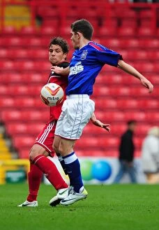Bristol City U21s V Ipswich Town Collection: Bristol City's Curtis Jones Tackles Ipswich Town's Bryan Lawrence in Intense U21s Clash
