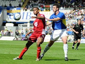 Bristol City`s Danny Haynes is closely marked by Cardiffs Tony Gerrard