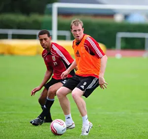 Training Prints: Bristol Citys David Clarkson battles for the ball with Bristol Citys Lewin Nyatanga