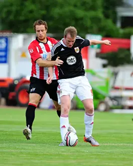 Bristol Citys David Clarkson battles for the ball with Ryan Harley