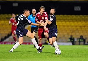 Images Dated 10th August 2010: Bristol City's David Clarkson Fights for Possession Amidst Southend United's Graham Coughlan