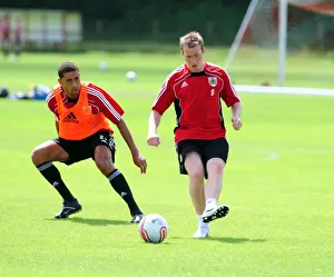 Pre-Season Training Prints: Bristol Citys David Clarkson shadowed by Bristol Citys Lewin Nyatanga