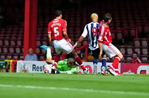 Season 11-12 Prints: Bristol City's David James Denies West Brom's Peter Odemwingie: A Championship Showdown at Ashton Gate