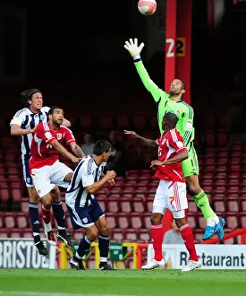 Season 11-12 Prints: Bristol City's David James Leaps for the High Ball against West Brom