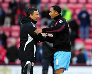 Bristol City V West Ham Prints: Bristol City's Derek McInnes and Nicky Maynard: A Heartwarming Embrace After the Match at Ashton Gate Stadium