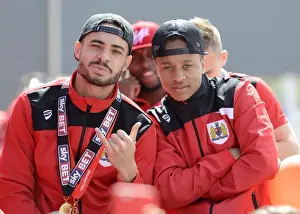 Bristol City's Derrick Williams and Bobby Reid Celebrate Promotion to Championship