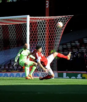 Bristol City V Swindon Town Prints: Bristol City's Derrick Williams Reaches for the Ball in Intense Football Action