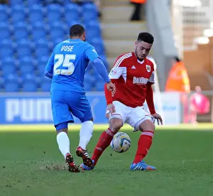 Framed Print : Bristol City's Derrick Williams Tackles Colchester United's Dominic Vose in Sky Bet League One Clash