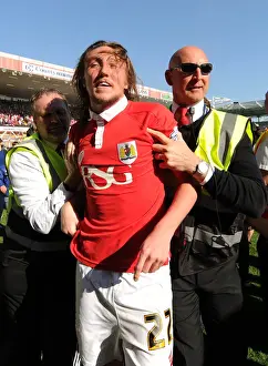 Title Prints: Bristol City's Euphoric Celebrations: Luke Ayling Led Back After Fans Invade Pitch to Secure League One Victory