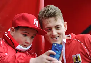 Bristol City V Barnsley Prints: Bristol City's George Saville Engages with Fans during Bristol City vs Barnsley Match