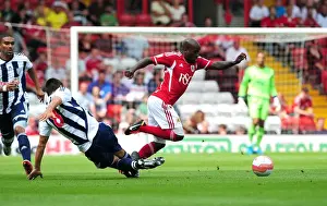 Season 11-12 Prints: Bristol City's Jamal Campbell-Ryce Outmaneuvers Paul Scharner of West Brom in Championship Clash at Ashton Gate