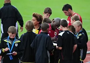Images Dated 19th July 2010: Bristol Citys Jamal Camplbell-Ryce and Bristol Citys Bradley Orr sign autographs for the academy