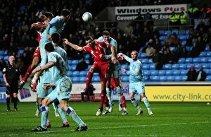 Images Dated 26th December 2011: Bristol City's James Wilson vs Coventry City's Richard Wood - Championship Clash at Ricoh Arena