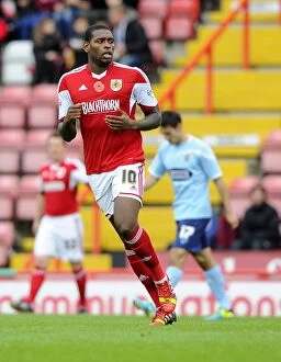 Images Dated 9th November 2013: Bristol City's Jay Emmanuel-Thomas in Action during FA Cup Match against Dagenham and Redbridge