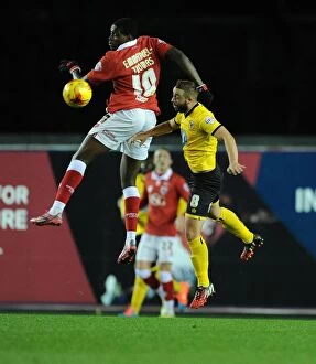 Images Dated 11th November 2014: Bristol City's Jay Emmanuel-Thomas Battles for High Ball Against AFC Wimbledon's Sammy Moore during