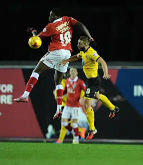 Bristol City's Jay Emmanuel-Thomas Battles for High Ball Against AFC Wimbledon's Sammy Moore during Johnstone's Paint Trophy Match