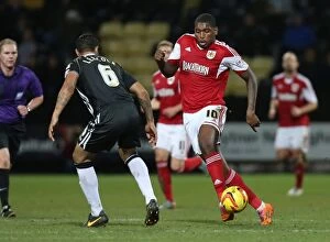 Images Dated 21st December 2013: Bristol City's Jay Emmanuel-Thomas Charges Forward Against Notts County's Dean Leacock in Sky Bet