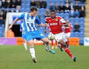 Images Dated 22nd March 2014: Bristol City's Jay Emmanuel-Thomas Chases Down Tom Eastman during Colchester United vs