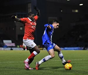 Images Dated 6th January 2015: Bristol City's Jay Emmanuel-Thomas Closes In on Gillingham's Doug Loft during Johnstone's Paint