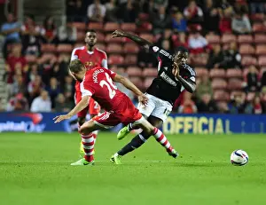 Southampton V Bristol City Prints: Bristol City's Jay Emmanuel-Thomas Evades Jos Hooiveld in Southampton Showdown