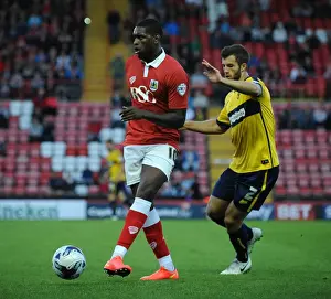 Capital One Prints: Bristol City's Jay Emmanuel-Thomas Faces Off Against Oxford United's Jonathan Meades in Capital One Cup Clash