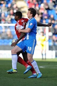 Images Dated 22nd March 2014: Bristol City's Jay Emmanuel-Thomas Fends Off Tom Eastman of Colchester United